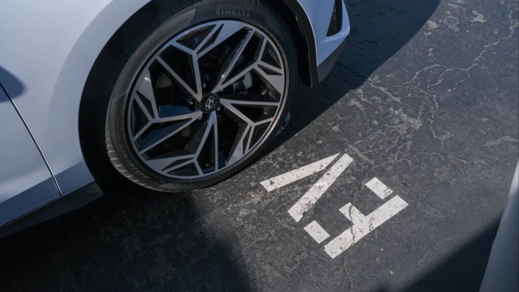 A Hyundai Ioniq 6 at an Electrify America charging station in Oakland on Feb. 27, 2024. (CalMatters/Camille Cohen)