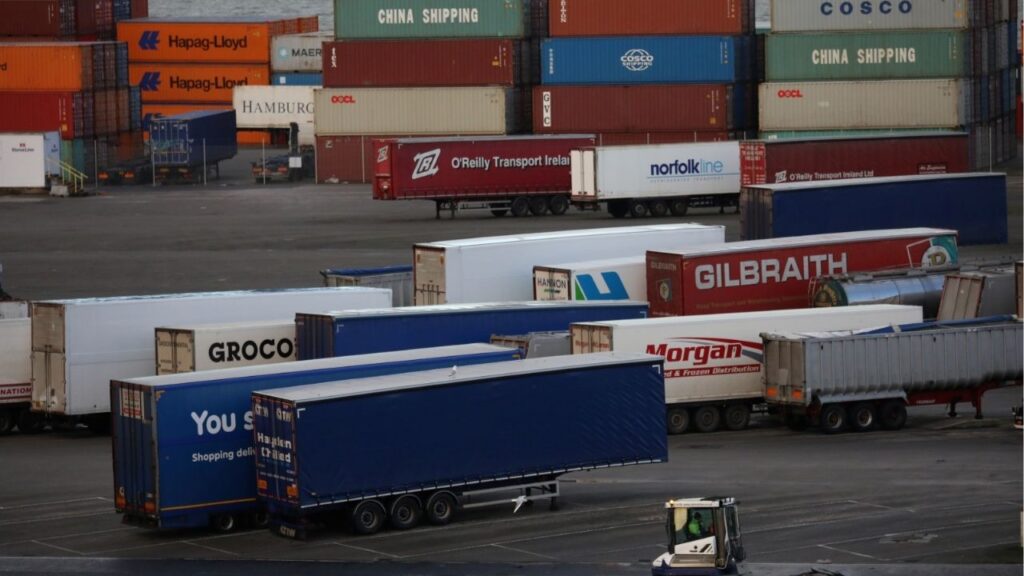 A port vehicle drives past trailers and shipping containers at the Port of Belfast, Northern Ireland January 2, 2021. REUTERS/Phil Noble