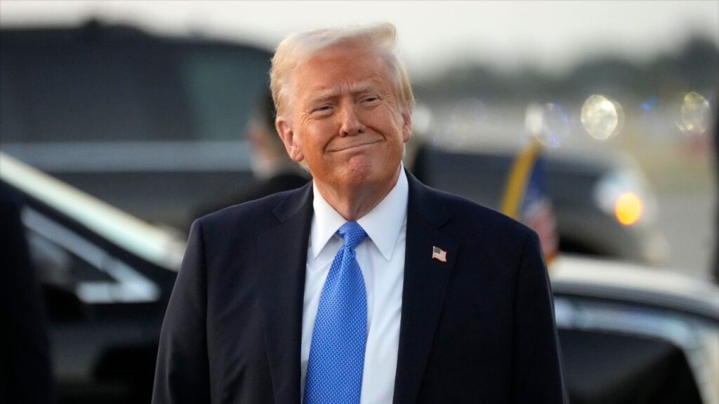 President Donald Trump smiles as he arrives on Air Force One at Palm Beach International Airport in West Palm Beach, Fla., Friday, Feb. 7, 2025. (AP/Ben Curtis)
