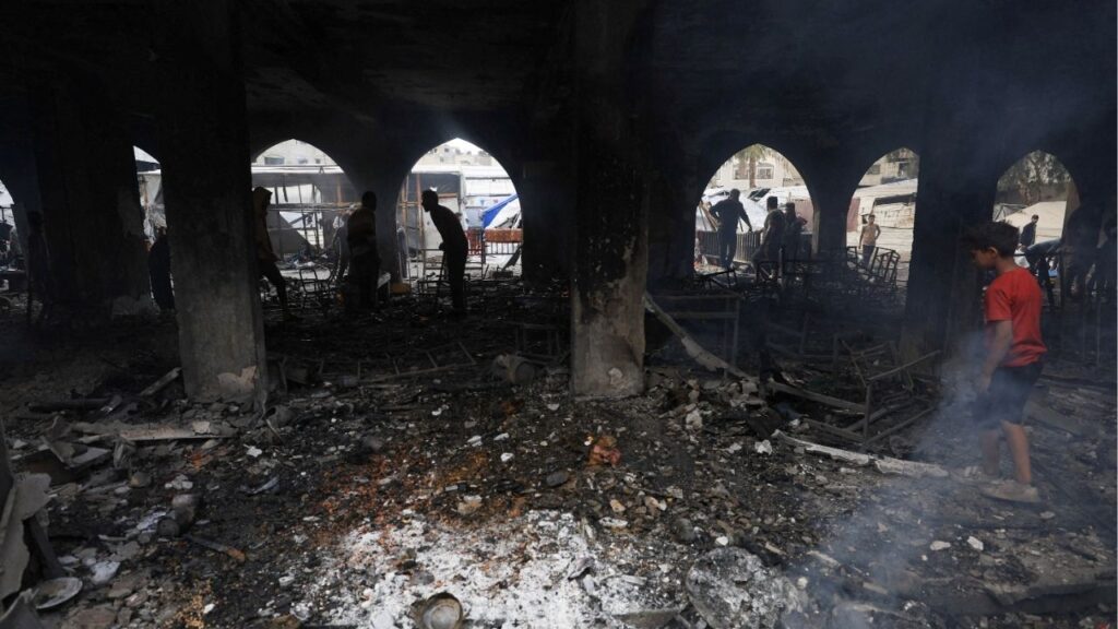 Palestinians inspect the damage at a school sheltering displaced people, following an Israeli strike, in Gaza City, April 23, 2025. (REUTERS/Dawoud Abu Alkas)